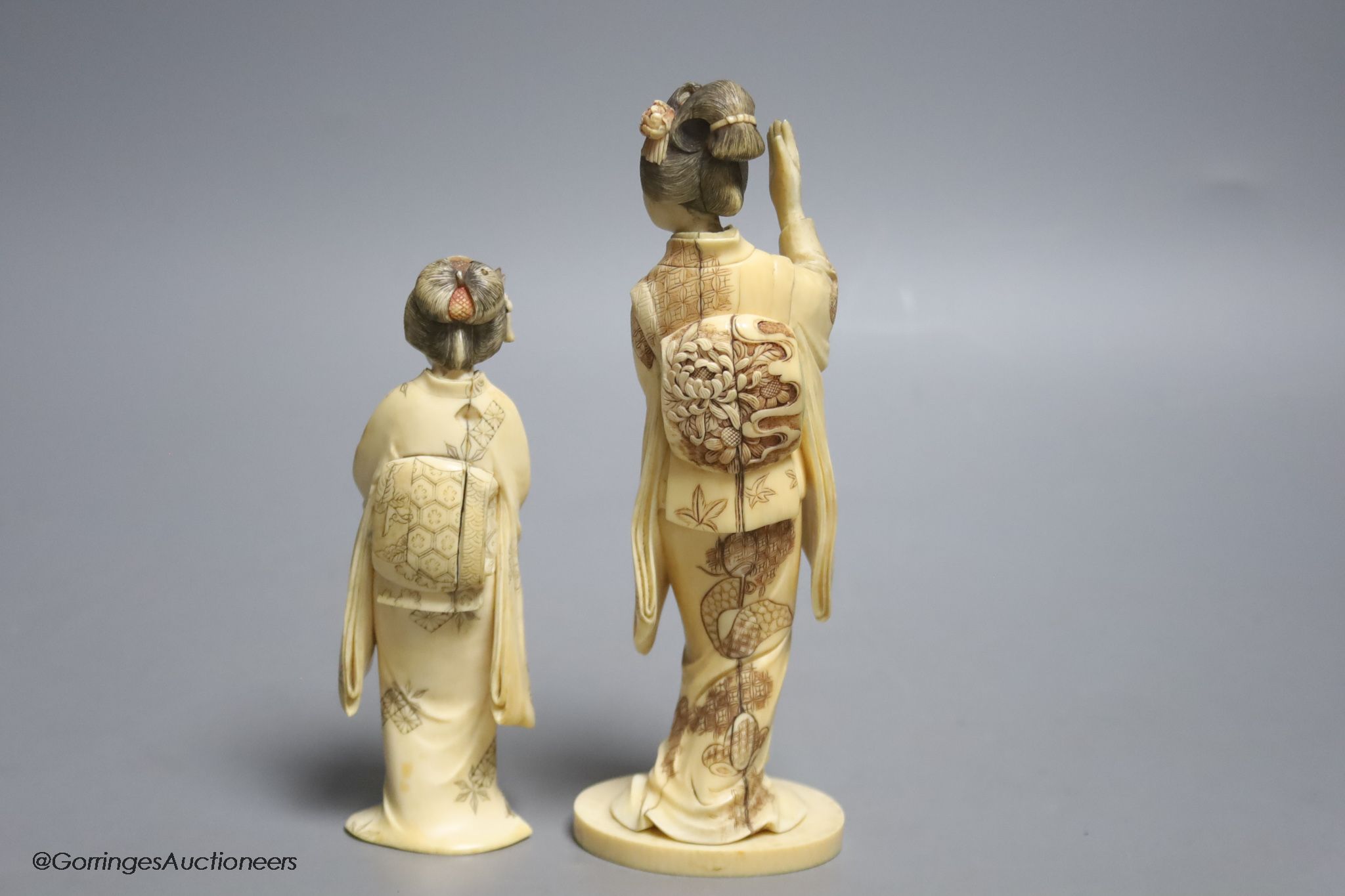 Two Japanese ivory figures of bijin, early 20th century, one signed to the base, height 17.5cm